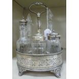 A late Victorian/Edwardian silver plated oval cruet stand with a decoratively pierced,