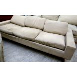 A 1960s three person box settee with a low, level upstand back,