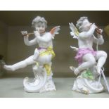 A pair of early 20thC Frankenthal porcelain seated cherubic figures, one playing panpipes,