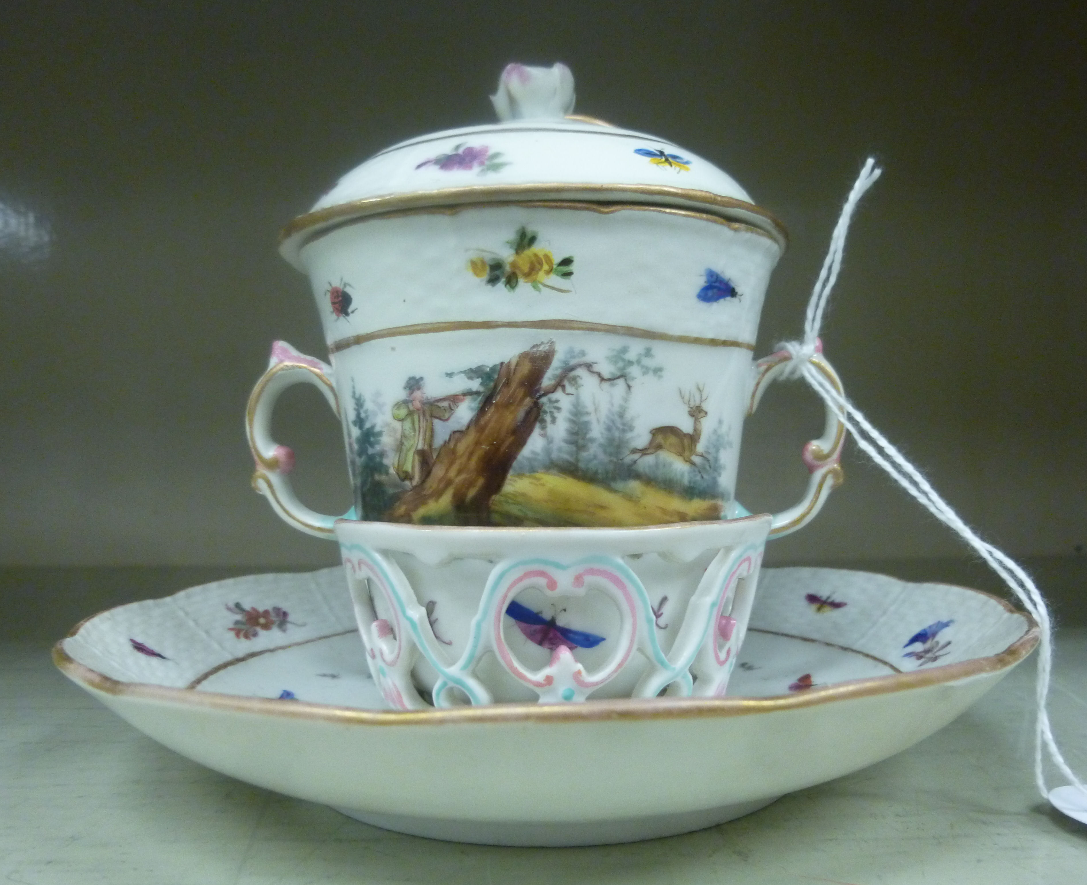 A late 18thC Berlin porcelain covered, twin handled chocolate cup and cover,