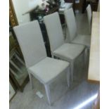 A set of eight modern painted cream coloured Lloyd Loom dining chairs with high backs,