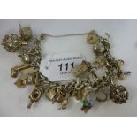 A silver curb link charm bracelet 11