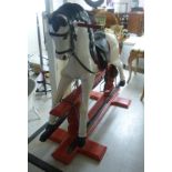 A 1920/30s carved and painted wooden nursery rocking horse,