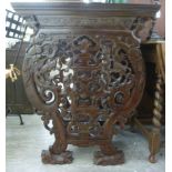 A modern Chinese stained hardwood side table, the mitred top over an end drawer and undershelf,