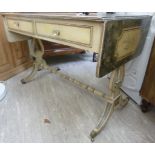 An 'antique' finished painted pine sofa style dressing table with two in-line frieze drawers,