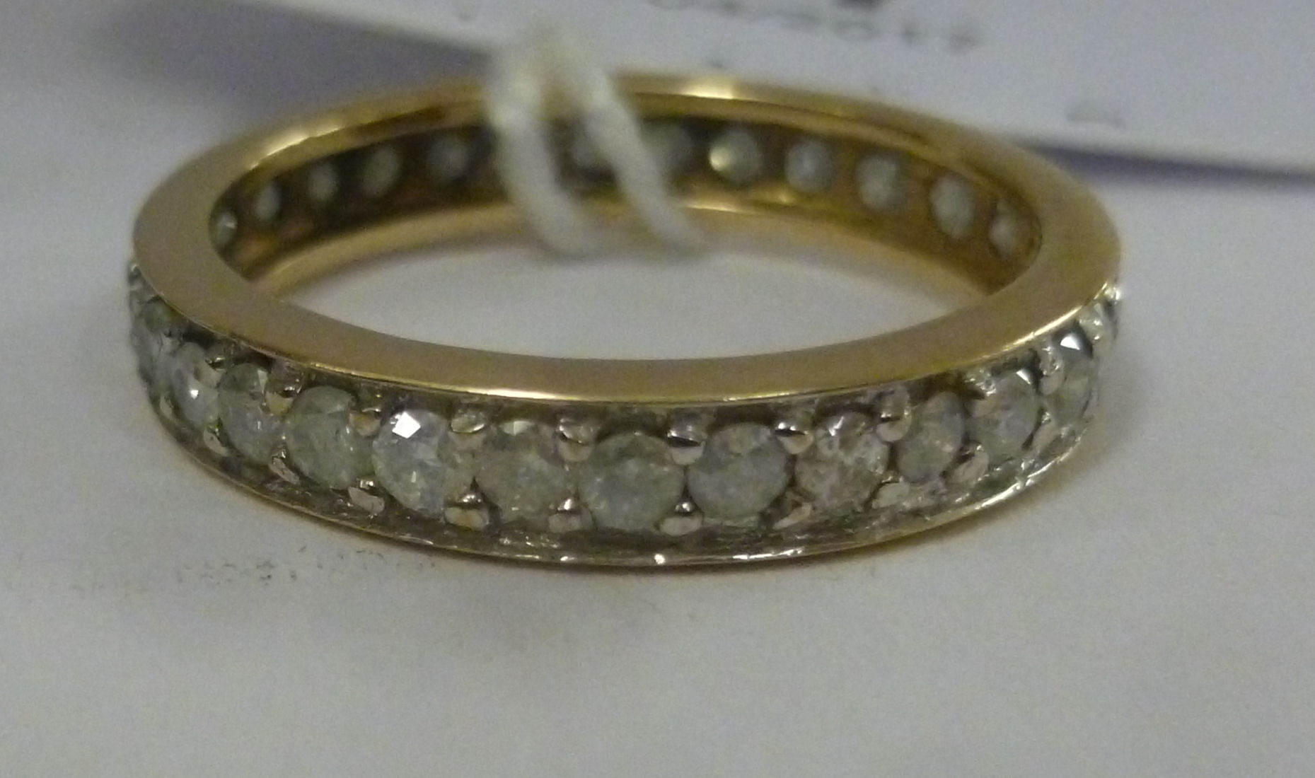 A gold coloured metal and diamond set full eternity ring 11