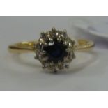 An 18ct gold sapphire and diamond cluster ring 11