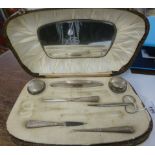 An engine turned silver mounted and handled manicure set Birmingham 1928 in a fitted,