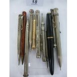 Twelve assorted writing instruments: to include silver and silver coloured metal propelling pencils