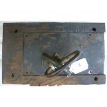 An 18thC iron rim lock with a brass escutcheon plate,