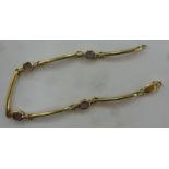 A 9ct gold bead and rod link bracelet,