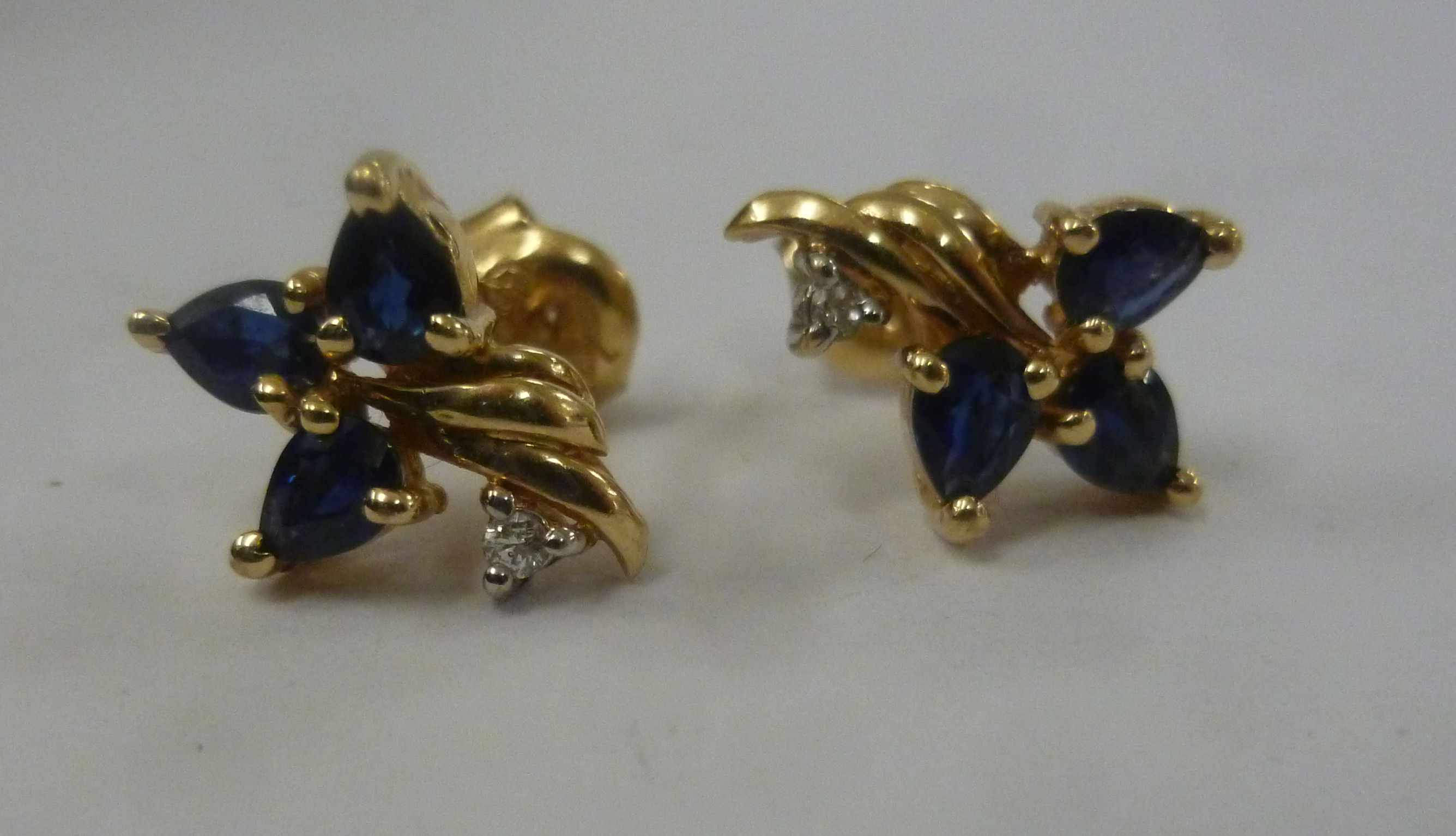 A pair of 14ct gold sapphire and diamond set earrings 11