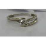 A 9ct bi-coloured gold single stone diamond ring in a crossover setting 11