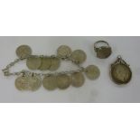 A silver 3d piece coin set bracelet; an 1836 shilling pendant; and a silver ring,