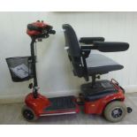 A Mini-Shuttle electrically powered, invalid's scooter,