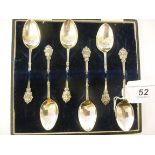 A set of six silver teaspoons, the stems cast with leaves,