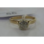 A 9ct gold claw set diamond cluster ring 11