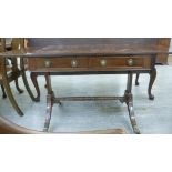 A 1920s reproduction of a Georgian ebony inlaid mahogany sofa table with two in-line frieze drawers
