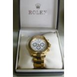 A replica Rolex Daytona yellow metal plated bracelet watch, the movement with sweeping seconds,