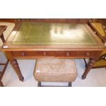 A late Victorian mahogany writing table, the top with a tooled and gilded hide scriber,