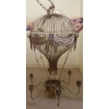 An early 1960s French Montgolfier six branch painted and gilded metal light fitting,