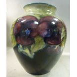 A Moorcroft pottery vase of baluster form, decorated in a version of the Pansy design,