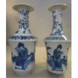 A matched pair of mid 19thC Chinese porcelain vases of waisted, shouldered form with long,