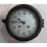 A Chelsea Ship's Bell textured matt black finished alloy cased bulkhead clock with a hinged bezel;