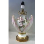 An early 20thC gilded porcelain and lacquered brass mounted table lamp of ovoid vase design,