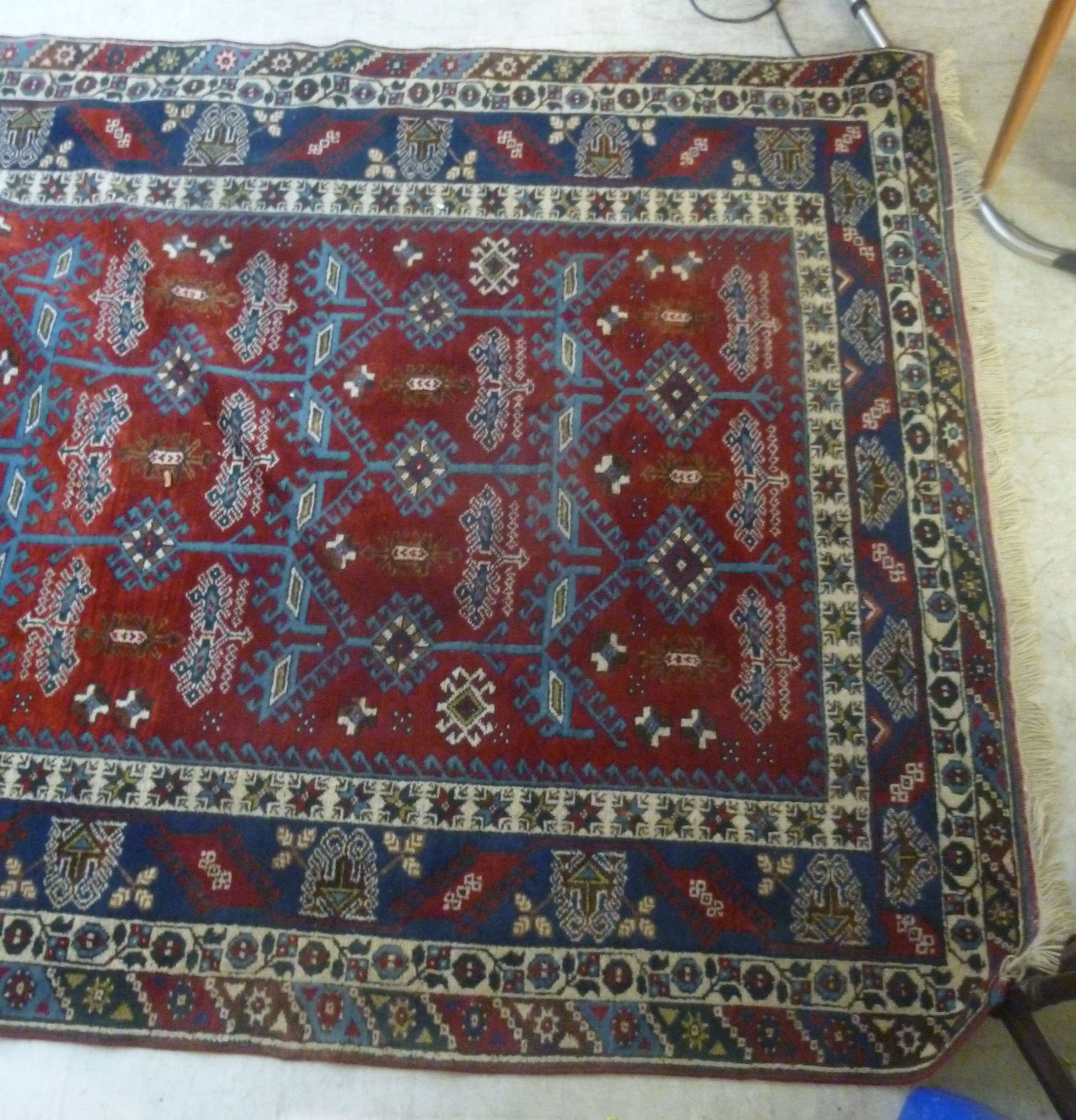 A Turkish carpet with stylised designs on a blue and red ground 110'' x 77'' - Image 2 of 5