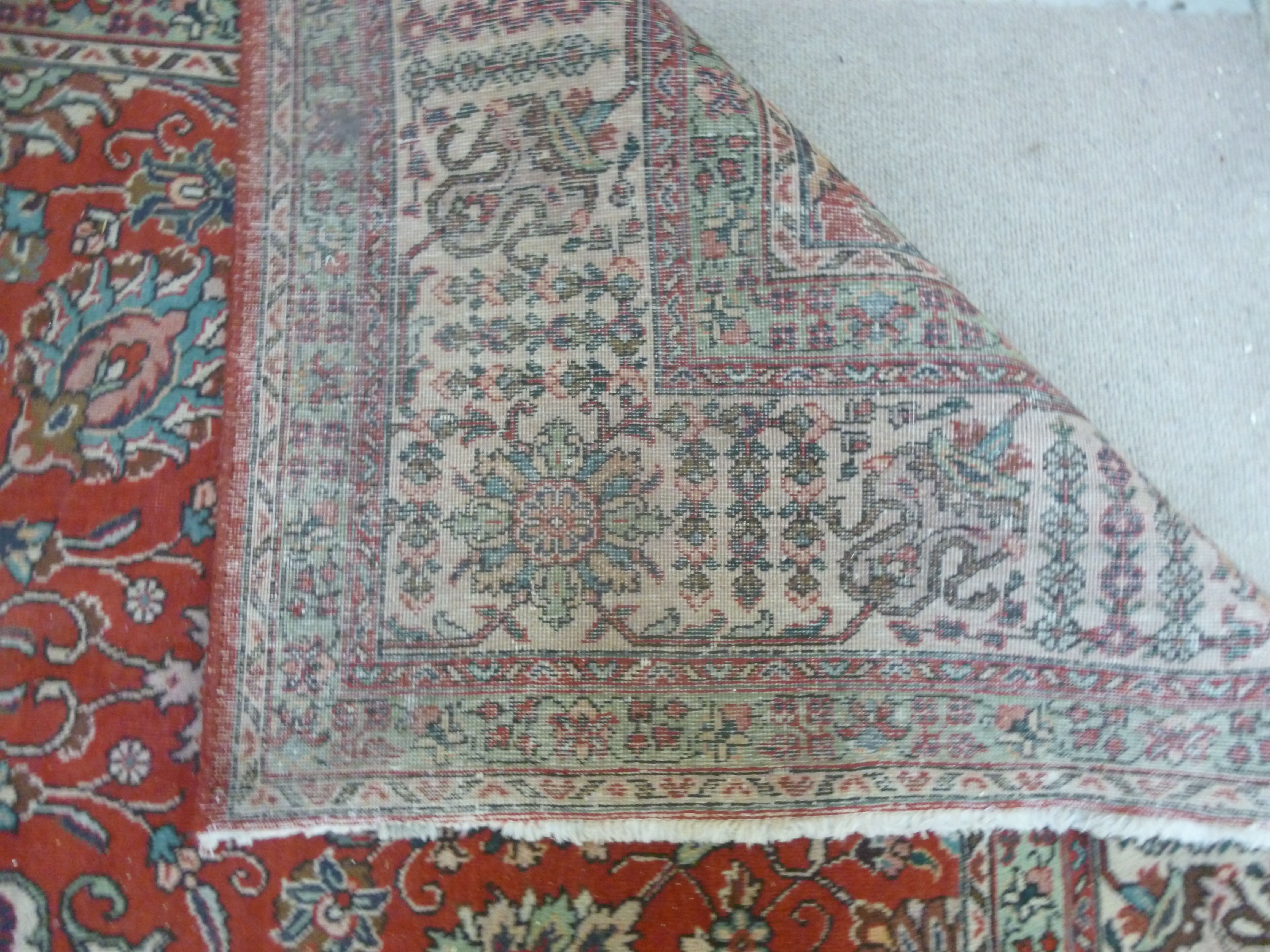 A Persian carpet with stylised designs bordered by foliage 333'' x 296'' - Image 7 of 7