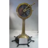 An early 20thC ship's brass engine room telegraph 13''h; later mounted on a miniature ship's wheel,