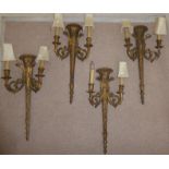 A set of four 19thC carved giltwood and gesso torch design appliques with twin,