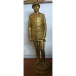 After Delanglade - a cast gilt bronze standing figure, a uniformed French artillery officer,