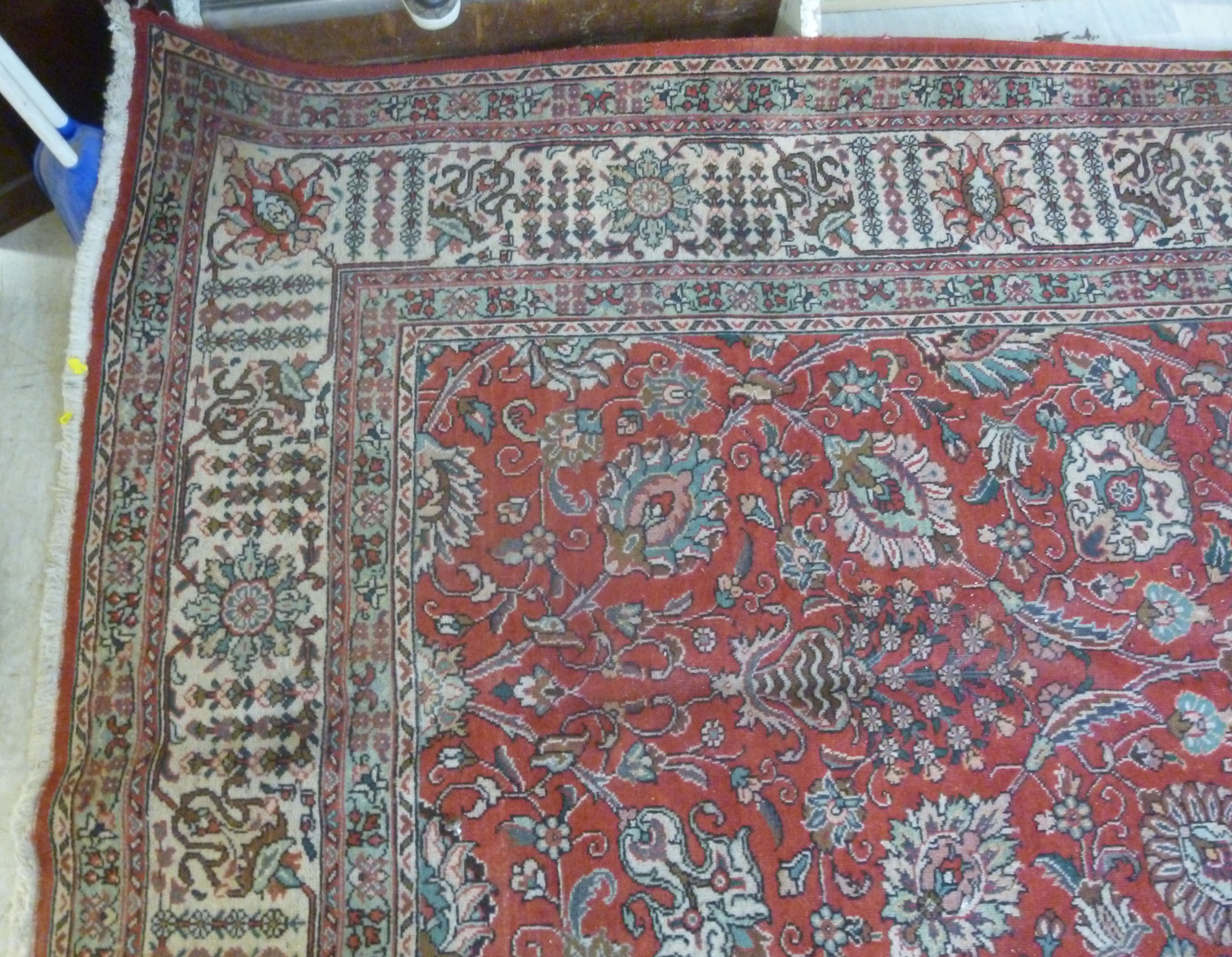 A Persian carpet with stylised designs bordered by foliage 333'' x 296'' - Image 5 of 7