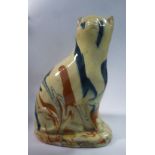 An early 19thC Delftware model novelty seated cat money bank,