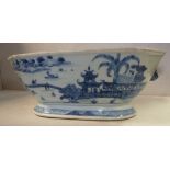 A late 18thC Chinese porcelain tureen of elongated octagonal form with moulded animal mask flank