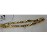 A 9ct gold curb link bracelet 11