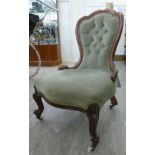 A late Victorian walnut showwood framed spoonback side chair, part button upholstered in braided,