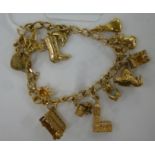 A 9ct gold bracelet with twelve charms 11