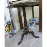 A late Victorian mahogany pedestal table, the wrythen, carved, tapered column,