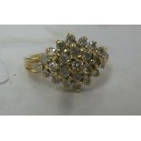 A 9ct gold claw set diamond cluster ring U