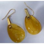A pair of 18ct gold mounted pear shaped amber pendant earrings stamped JSB
