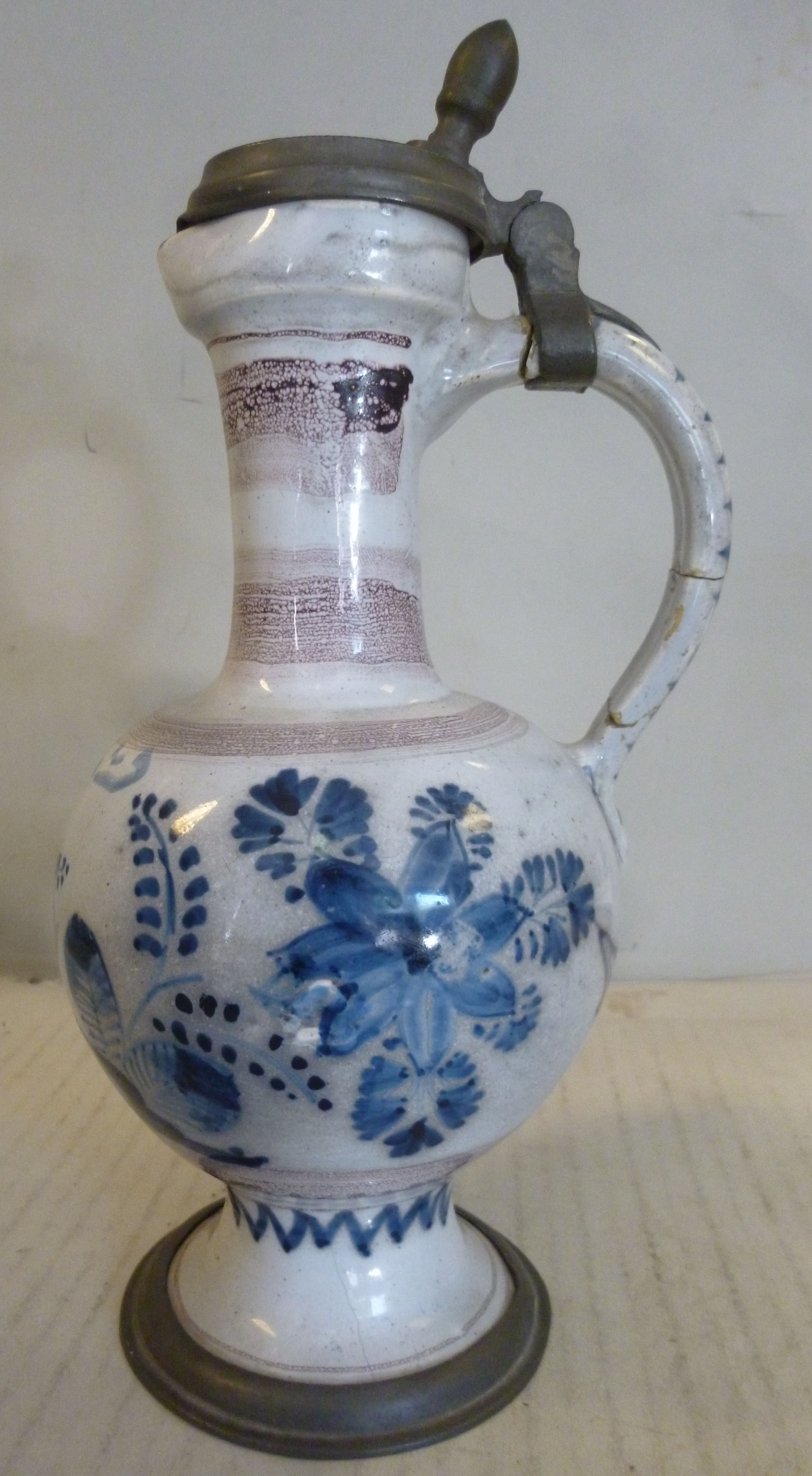 An 18thC German/North European Delftware ewer of bulbous form with a long narrow neck, loop handle, - Image 3 of 11