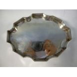A George III silver multi-incurved oval, galleried teapot stand,
