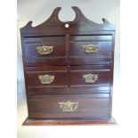 A late Victorian mahogany desktop collectors' cabinet, in the style of a miniature dressing chest,