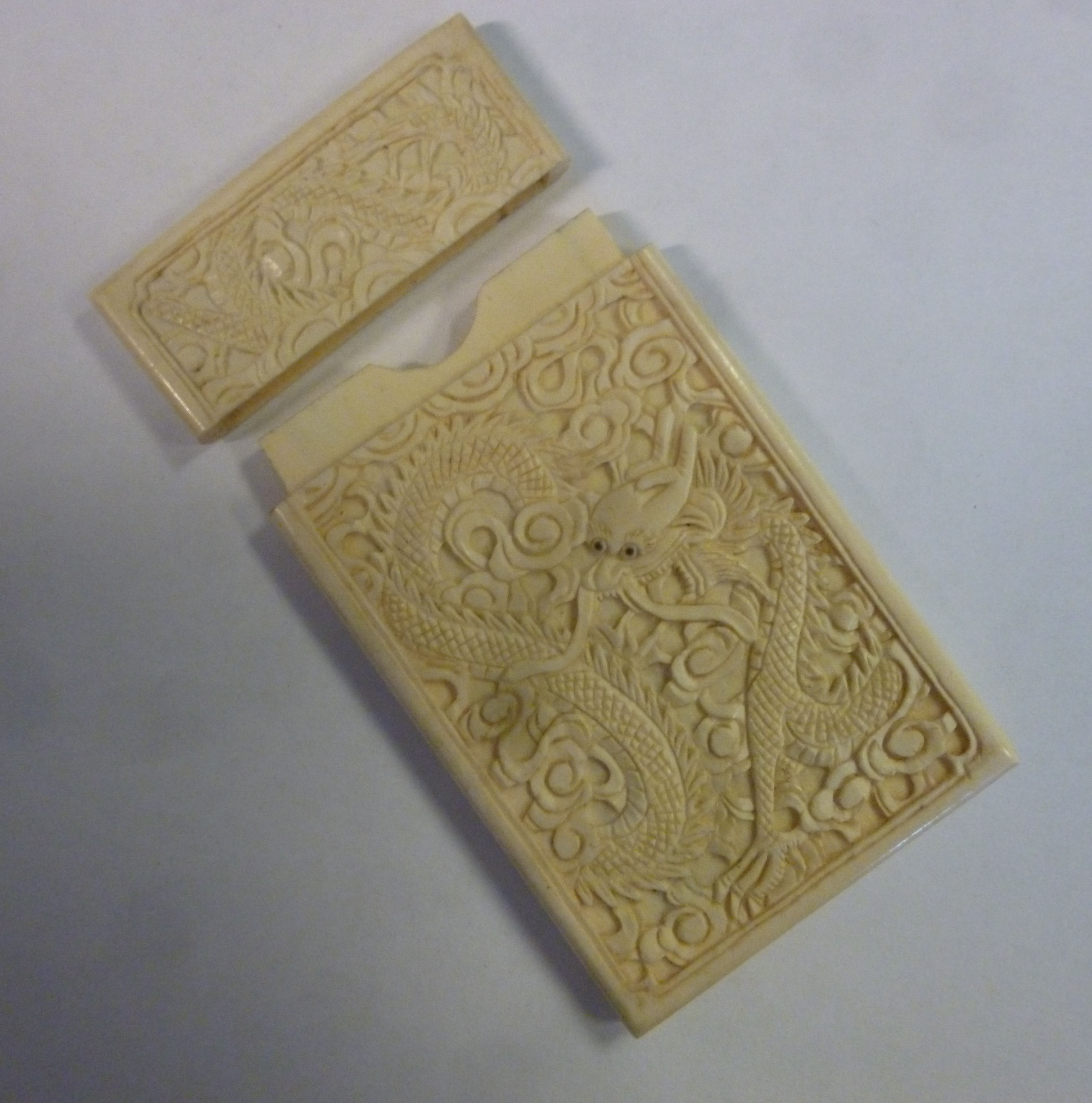 An early 20thC Japanese two-part carved ivory card case,