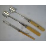 Two similar late 19thC silver plated stilton scoops and a pickle trident with an ejector,