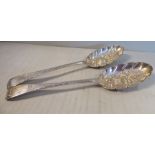 A pair of late 18thC silver Old English style berry spoons indistinct marks