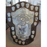 'The Ada Cuthbert Memorial Shield' a cast, chased, embossed and applied silver trophy,